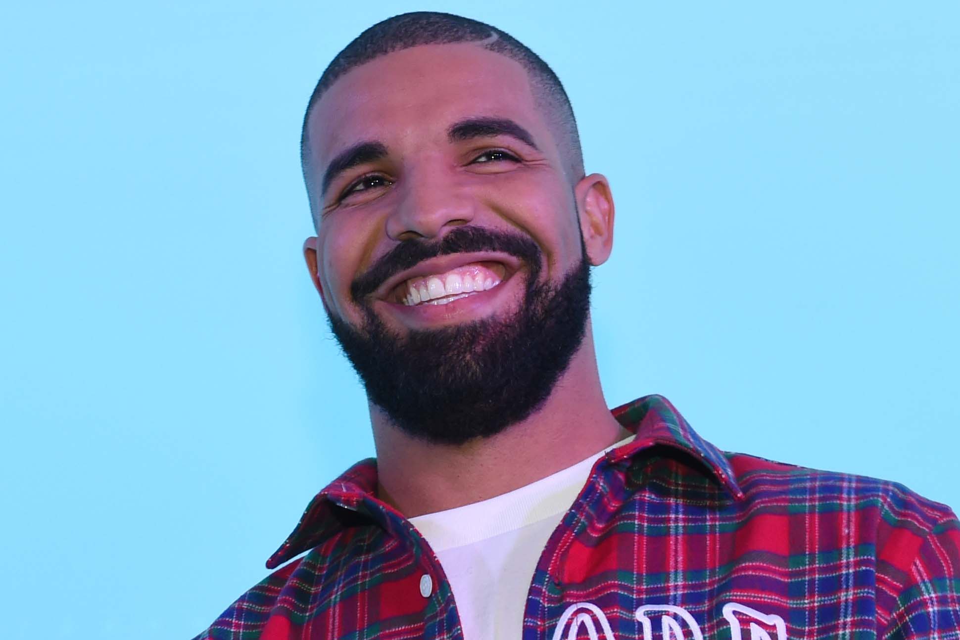 Drake smiling because he's great at telling stories with data