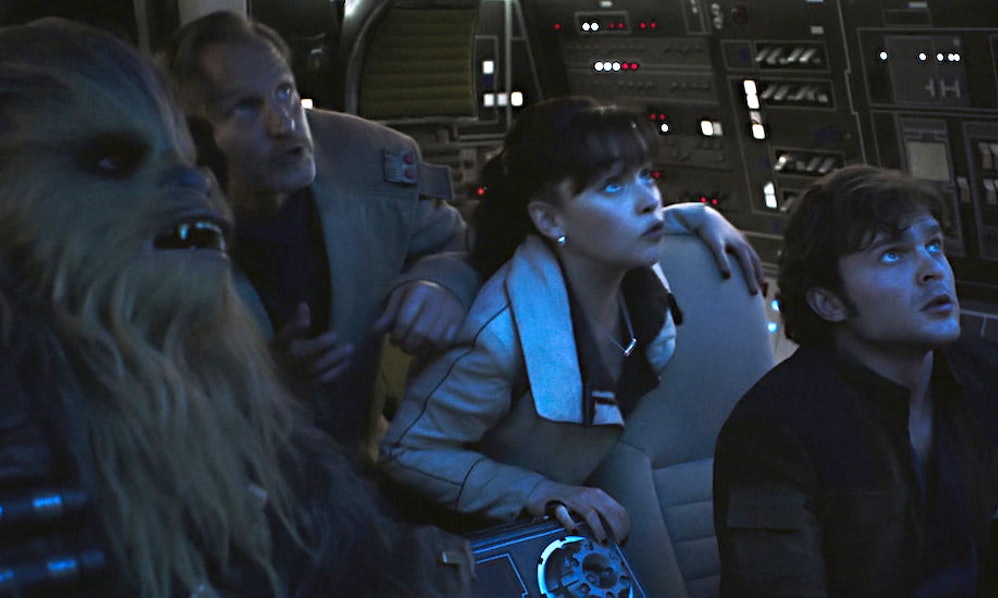 Chewbacca, Tobias Beckett (Woody Harrelson), Qi'Ra (Emilia Clarke), and Han Solo (Alden Ehrenreich) in Solo: A Star Wars Story
