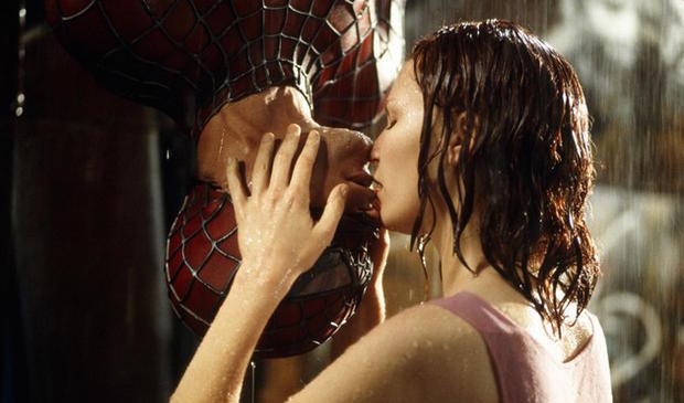 Peter Parker (Tobey Maguire) and Mary Jane Watson (Kirsten Dunst) kiss in the rain in Sam Raimi's Spider-Man