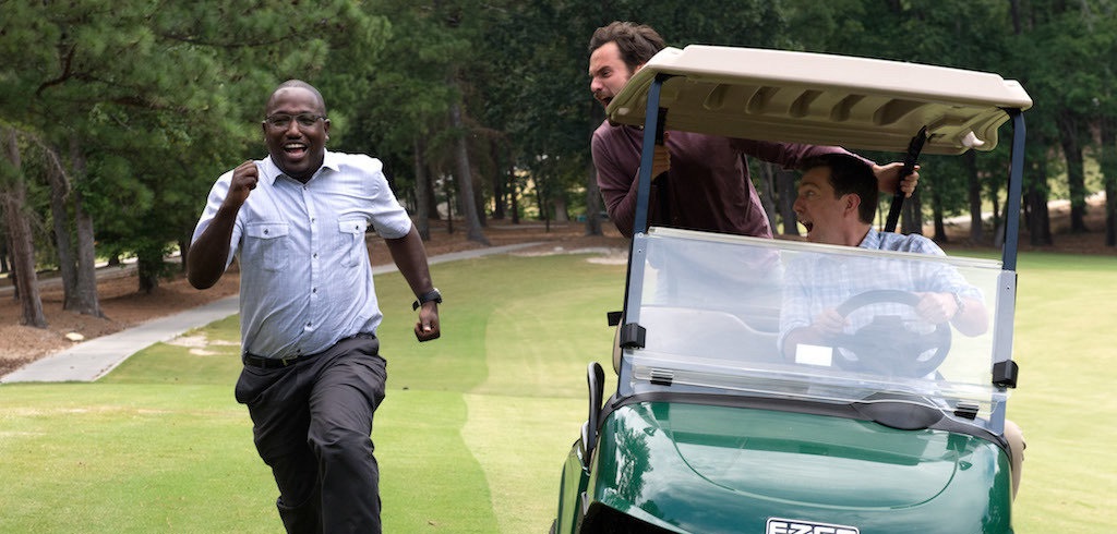Sable (Hannibal Buress), Chilli (Jake Johnson) and Hoagie (Ed Helms) chase a golf cart in the movie Tag