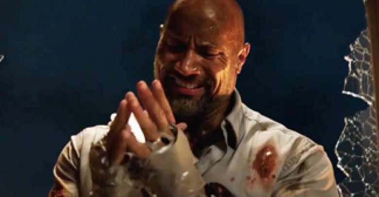 Will Sawyer (Dwayne Johnson) wraps his hands in duct tape in the action movie Skyscraper