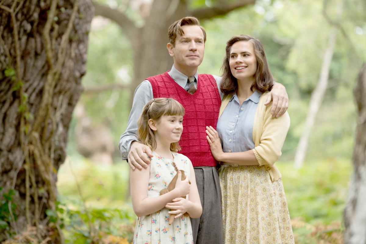Christopher Robin (Ewan McGregor) and his family, daughter Madeline (Bronte Carmichael) and wife Evelyn (Hayley Atwell) in the Hundred Acre Wood