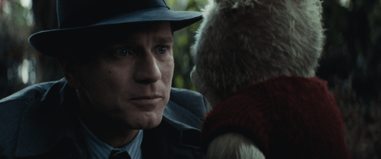 An adult Christopher Robin (Ewan McGregor) and Winnie the Pooh see each other for the first time in 30 years