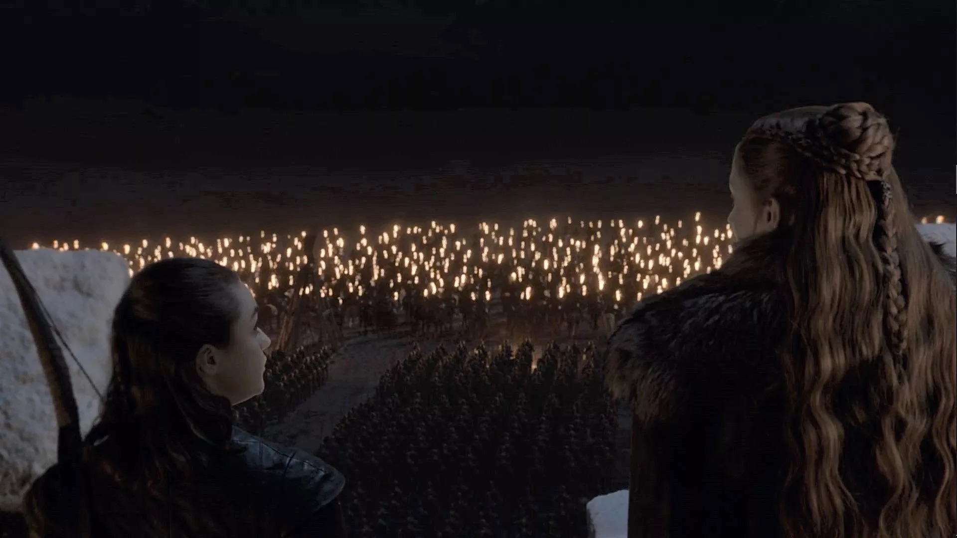 Arya Stark (Maisie Williams) and Sansa Stark (Sophie Turner) overlook the Dothraki and Unsullied armies before the Battle of Winterfell in "the Long Night"