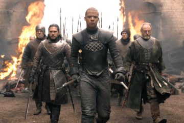 Jon Snow (Kit Harrington), Grey Worm of the Unsullied (Jacob Anderson), Ser Davos Seaworth (Liam Cunningham) and their army enter the destroyed King's Landing in HBO's Game of Thrones Season 8 Episode "The Bells"