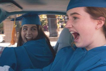 Molly (Beanie Feldstein) and Amy (Kaitlyn Dever) drive to graduation in Booksmart
