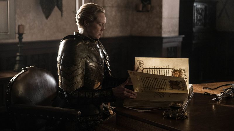 Head of the Kingsguard Ser Brienne of Tarth (Gewndoline Christie) writes the story of Jaime Lannister in the White Book on the final Game of Thrones episode, "The Iron Throne"