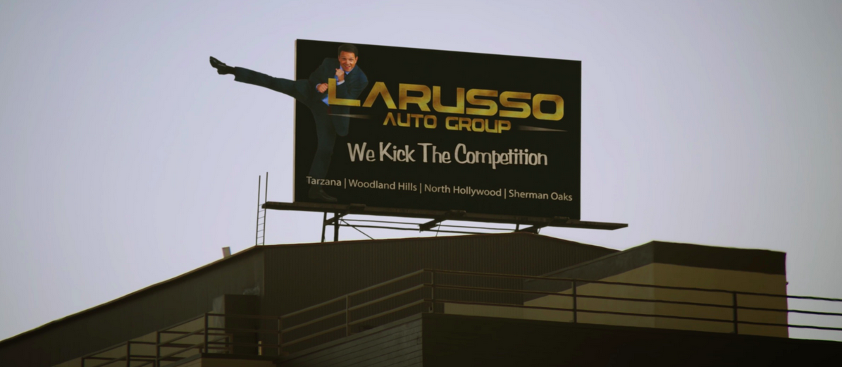 LaRusso auto group billboard overlooking Los Angeles in the Cobra Kai TV series