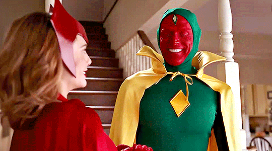 Elizabeth Olsen and Paul Bettany wear Scarlet Witch and Vision Halloween costumes in WandaVision 