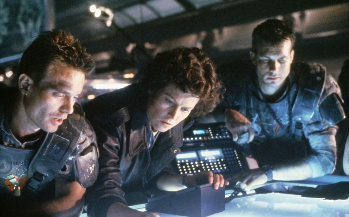 Hicks, Ripley, and Hudson strategize in Aliens