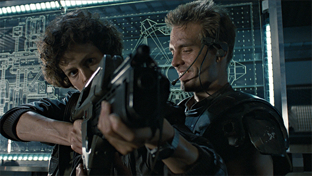 Ripley practices her weapons training with Hicks in Aliens