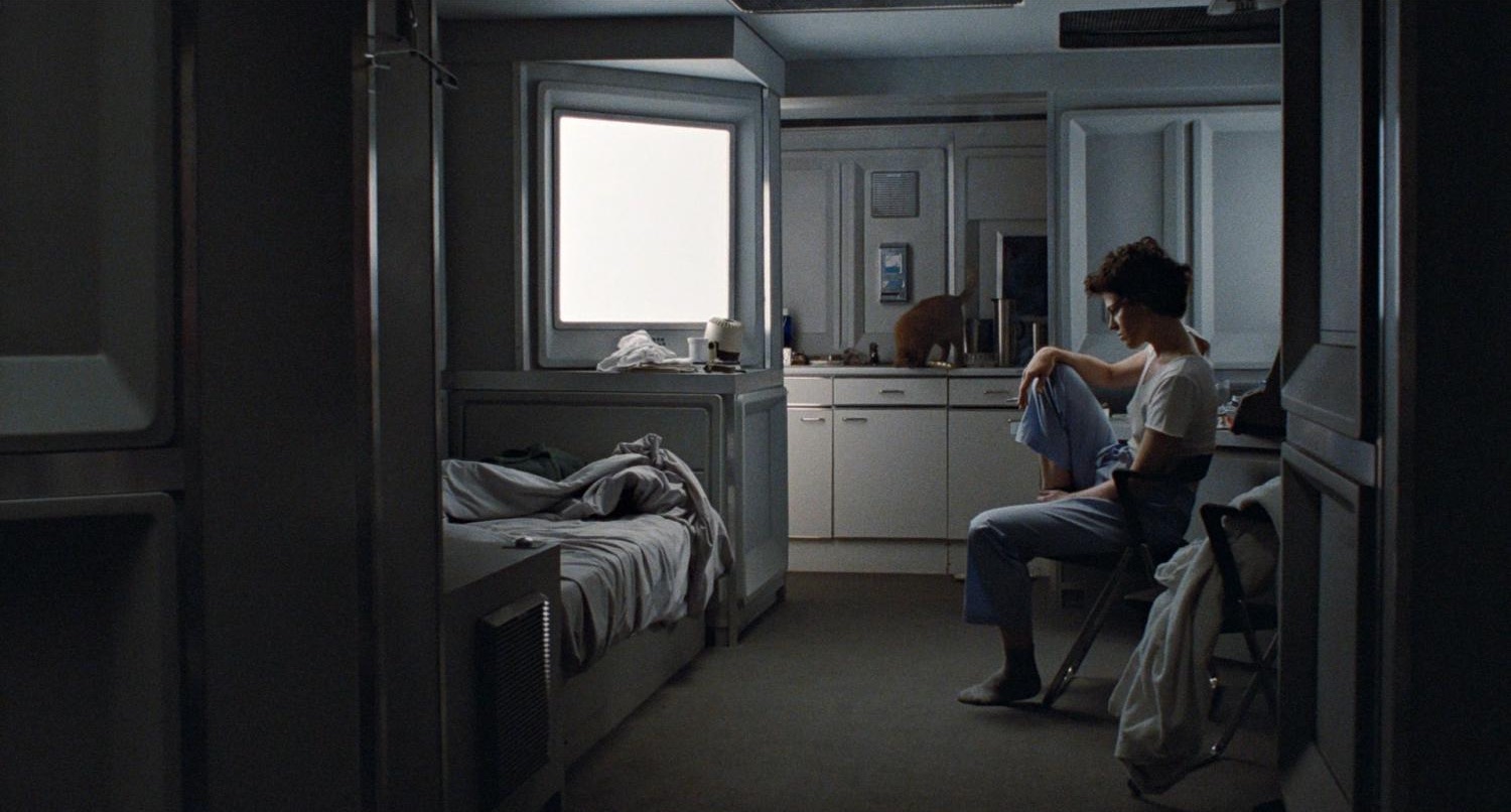 Ripley (Sigourney Weaver) sits in her apartment in the 1986 movie Aliens