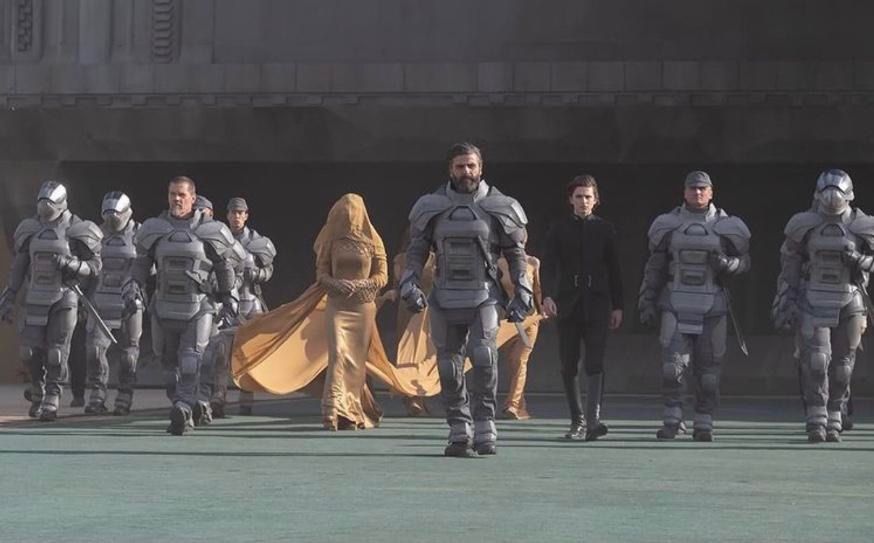 House Atreides, including Gurney Halleck (Josh Brolin), Duke Leto Atreides (Oscar Isaac), and Paul Atreides (Timothee Chalamet) arrive on Arrakis in Dune (2021)