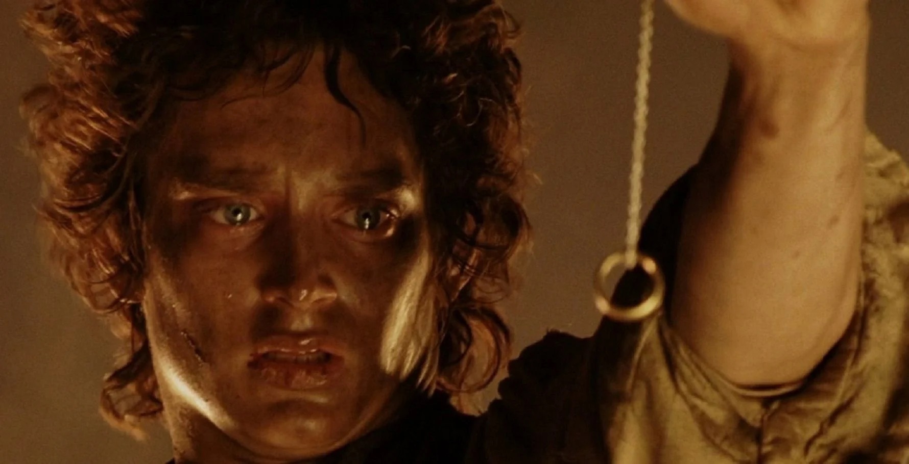 Elijah Wood as Frodo trying to destroy the One Ring in The Lord of the Rings movie