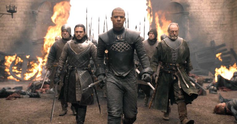Jon Snow (Kit Harrington), Grey Worm of the Unsullied (Jacob Anderson), Ser Davos Seaworth (Liam Cunningham) and their army enter the destroyed King's Landing in HBO's Game of Thrones Season 8 Episode "The Bells"